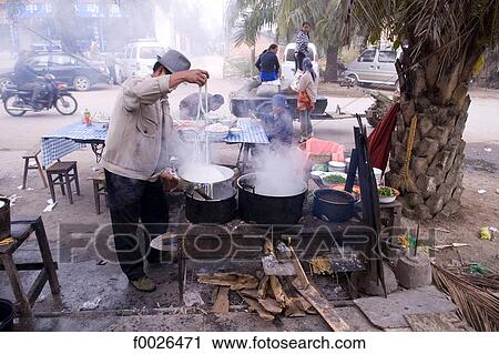 China, Yunnan, Xishuangbanna, near Jinghong, street cooking View Large Photo Image Stock Image - China, Yunnan, Xishuangbanna, near Jinghong, street cooking. Fotosearch