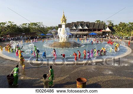 China, Yunnan, Xishuangbanna, near Jinghong, Dai Minority Park, during Water Splashing Festival View Large Photo Image Stock Photograph - China, Yunnan, Xishuangbanna, near Jinghong, Dai Minority Park, during Water Splashing Festival. Fotosearch