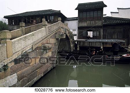 China, Zhejiang, Wushen, bridge over the river View Large Photo Image Stock Photograph - China, Zhejiang, Wushen, bridge over the river. Fotosearch