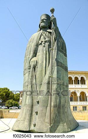 Stock Image - Cyprus, Nicosia, statue of Archbishop Makarios III in front of the Archbishopric Palace. Fotosearch