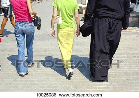 Stock Photograph - Cyprus, Paphos, seafront promenade, pedestrians. Fotosearch