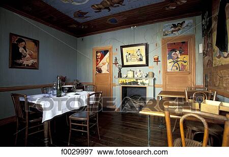 Stock Photo - France, Brittany, Le Pouldu, "Auberge de la plage", dinning room decorated by Paul Gauguin and his friends. Fotosearch