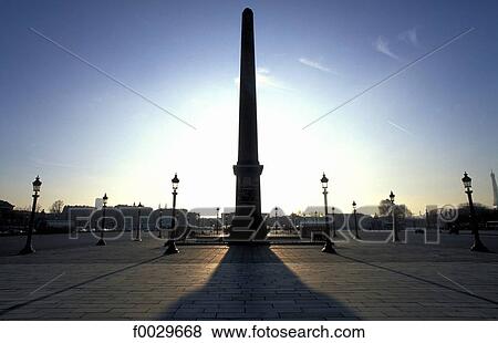 Stock Photo - France, Paris, place de la concorde, obelisk at dusk. Fotosearch