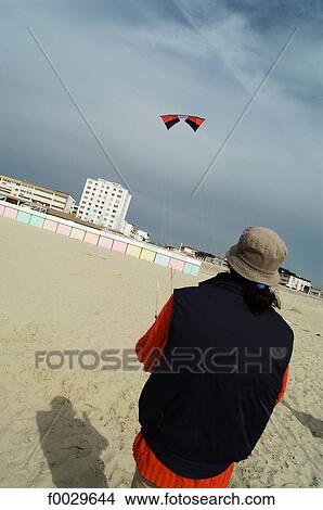 France, Pas-de-Calais, Berck, beach, playing kite View Large Photo Image Picture - France, Pas-de-Calais, Berck, beach, playing kite. Fotosearch