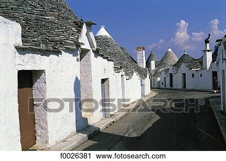Stock Image - Italy, Apulia, Alberobello, traditional dwellings called "Trullo". Fotosearch