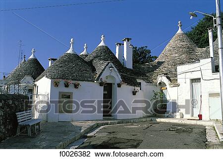 Stock Image - Italy, Apulia, Alberobello, traditional dwellings called "Trullo". Fotosearch