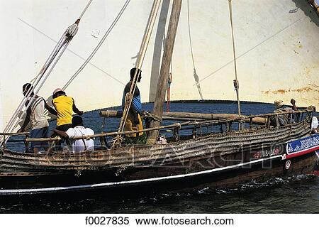 Kenya, Lamu, fishermen on a dhow View Large Photo Image Stock Photography - Kenya, Lamu, fishermen on a dhow. Fotosearch