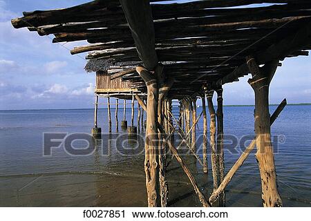 Stock Image - Kenya, Lamu, pier and house on piles. Fotosearch