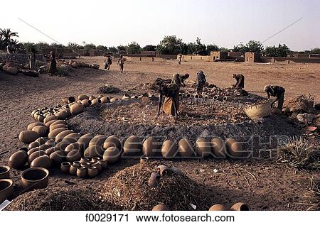 Niger, Myrriah, baking "canari" pottery View Large Photo Image Stock Image - Niger, Myrriah, baking "canari" pottery. Fotosearch