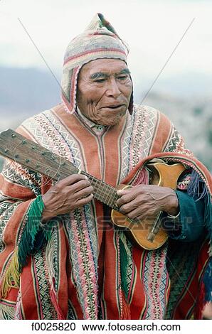 Peru, Cusco, Indian man playing the guitar View Large Photo Image Stock Image - Peru, Cusco, Indian man playing the guitar. Fotosearch