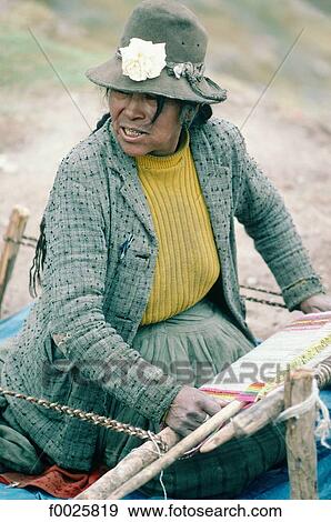 Peru, Cusco, Indian woman weaving llama wool View Large Photo Image Stock Photo - Peru, Cusco, Indian woman weaving llama wool. Fotosearch