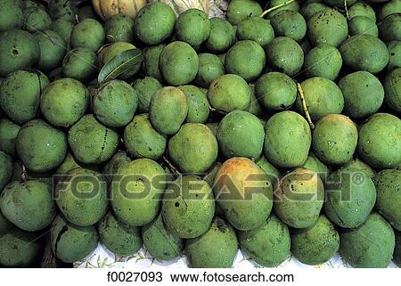 Stock Image - Reunion, mangoes on the market. Fotosearch