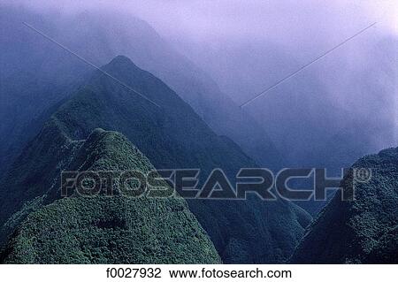 Stock Image - Reunion, woody mountains inside the island, aerial view. Fotosearch