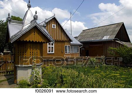 Stock Image - Romania, Moldavia, province of Bukovina, traditional dwelling and water well. Fotosearch