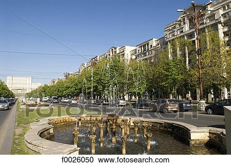 Stock Image - Romania, Muntenia, Bucharest, Unirii Boulevard, Palace of the Parliament in the distance. Fotosearch
