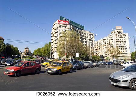 Stock Image - Romania, Muntenia, Bucharest, Unirii Square, traffic. Fotosearch