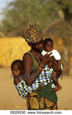 Senegal, Saloum delta, Sine Saloum, woman and his children View Large Photo Image Stock Image - Senegal, Saloum delta, Sine Saloum, woman and his children. Fotosearch