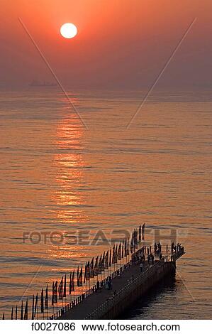 Stock Photograph - South Africa, Zululand, Durban, sunrise on the Marine Parade pier. Fotosearch