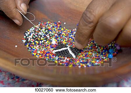 South Africa, Zululand, near Santa Lucia Park, Zulu craft center, making of beads jewels View Large Photo Image Stock Image - South Africa, Zululand, near Santa Lucia Park, Zulu craft center, making of beads jewels. Fotosearch