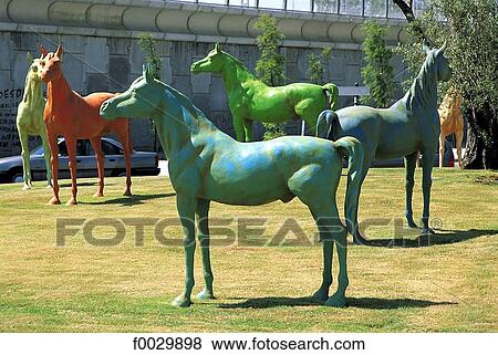 Stock Photo - Spain, Andalusia, Jerez de la Frontera, monument with colored horses near the jerez riding school. Fotosearch