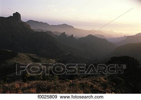 Stock Photo - Spain, Canary Islands, Gran Canaria, montains at sunrise. Fotosearch