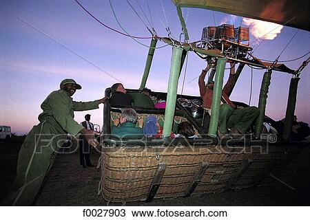 Tanzania, Serengeti National Park, hot air balloon leaving the ground View Large Photo Image Stock Image - Tanzania, Serengeti National Park, hot air balloon leaving the ground. Fotosearch