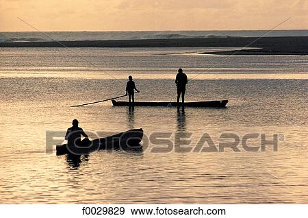 Stock Photo - Togo, Aného, fishermen at dusk. Fotosearch