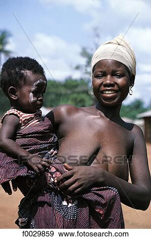 Togo, Evé young woman and her child View Large Photo Image Stock Photo - Togo, Evé young woman and her child. Fotosearch