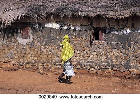 Stock Photo - Togo, Kotokoli country, Bafilo, woman by a traditional dwelling. Fotosearch