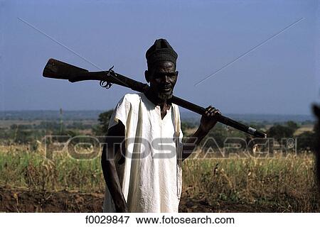 Stock Photo - Togo, Kotokoli country, near Bafilo, Kotokoli hunter. Fotosearch