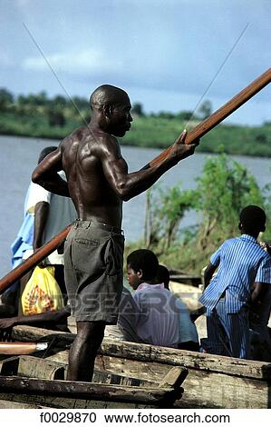 Togo, lake Togo, ferryman View Large Photo Image Stock Image - Togo, lake Togo, ferryman. Fotosearch