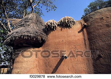 Stock Photo - Togo, Tamberma country, traditional dwelling, drying of sorghum. Fotosearch