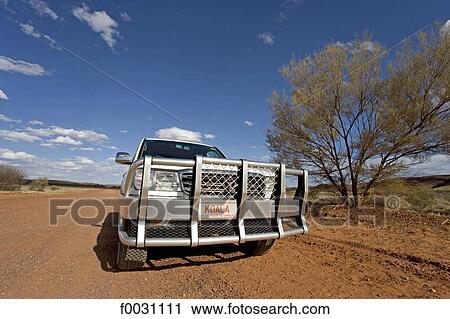 Stock Image - Australia, Northern Territory, Australia, Northern Territory, road from Alice Springs to Coober Pedy, 4x4. Fotosearch