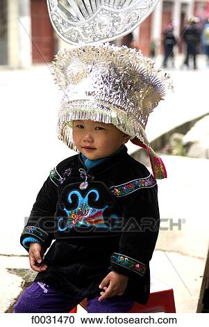 China, Guizhou, Taojiang village, portrait of a child in Miao traditional costume View Large Photo Image Stock Image - China, Guizhou, Taojiang village, portrait of a child in Miao traditional costume. Fotosearch