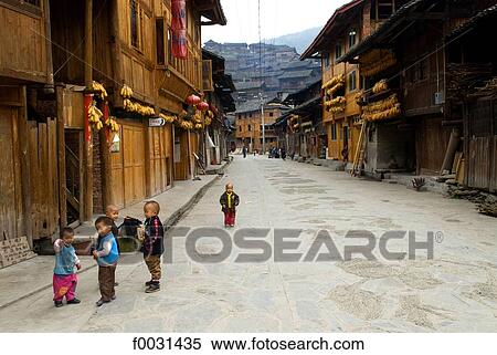 China, Guizhou, Xijiang village, children in the street View Large Photo Image Stock Photography - China, Guizhou, Xijiang village, children in the street. Fotosearch