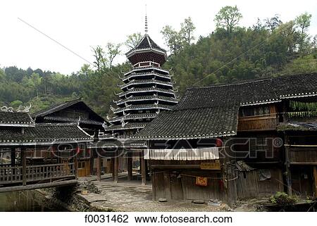 Stock Image - China, Guizhou, Zhaoxing village, drum tower. Fotosearch