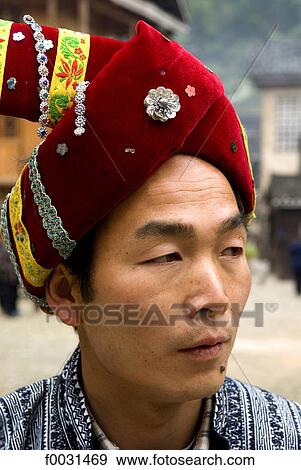 China, Guizhou, Zhaoxing village, portrait of a Dong man View Large Photo Image Stock Photo - China, Guizhou, Zhaoxing village, portrait of a Dong man. Fotosearch