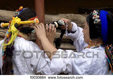 China, Sichuan, near Danba, Tibetan women preparing themselves for village festival View Large Photo Image Picture - China, Sichuan, near Danba, Tibetan women preparing themselves for village festival. Fotosearch
