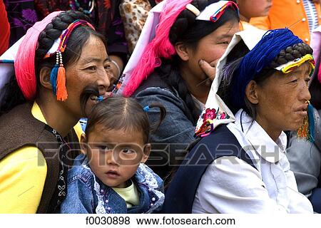 China, Sichuan, near Danba, Tibetan village festival, woman and young girl View Large Photo Image Stock Photo - China, Sichuan, near Danba, Tibetan village festival, woman and young girl. Fotosearch