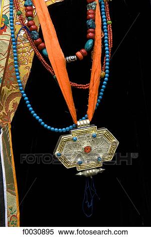 Stock Photography - China, Sichuan, near Danba, Tibetan traditional jewels wearing during a village festival. Fotosearch
