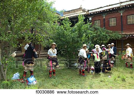 China, Sichuan, near Danba, Tibetans preparing themselves for village festival View Large Photo Image Stock Photograph - China, Sichuan, near Danba, Tibetans preparing themselves for village festival. Fotosearch
