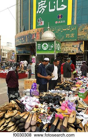 Stock Photo - China, Xinjiang, kashgar, shoes on sale. Fotosearch