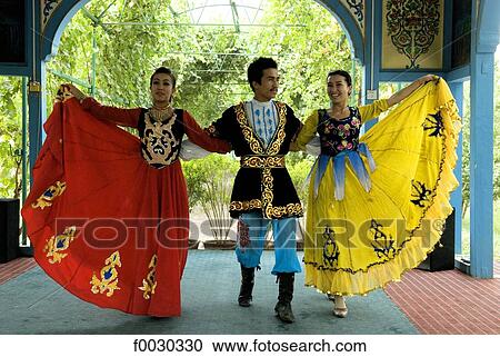 Stock Image - China, Xinjiang, traditional Uyghur dance. Fotosearch