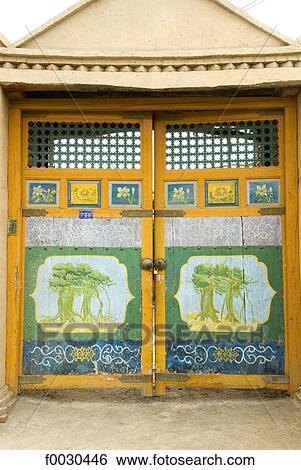 China, Xinjiang, Turpan, traditional Uyghur dwelling, painted doors View Large Photo Image Stock Photograph - China, Xinjiang, Turpan, traditional Uyghur dwelling, painted doors. Fotosearch