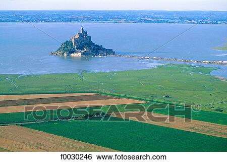 France, Normandy, Mont Saint-Michel and cultivated coastline, aerial view View Large Photo Image Stock Photograph - France, Normandy, Mont Saint-Michel and cultivated coastline, aerial view. Fotosearch