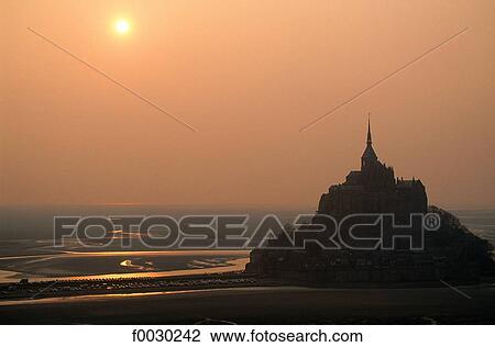 France, Normandy, Mont Saint-Michel, sunset by a misty day, aerial view View Large Photo Image Stock Image - France, Normandy, Mont Saint-Michel, sunset by a misty day, aerial view. Fotosearch