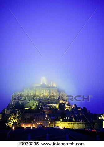 France, Normandy, Mont Saint-Michel, general view on a misty night View Large Photo Image Stock Photography - France, Normandy, Mont Saint-Michel, general view on a misty night. Fotosearch