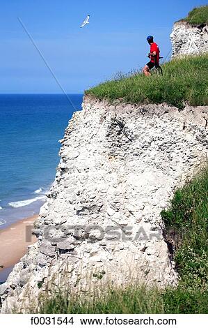 France, Pas-de-Calais, Opal Coast, cyclist on the verge of the cliffs of chalks of Cap Blanc-Nez View Large Photo Image Picture - France, Pas-de-Calais, Opal Coast, cyclist on the verge of the cliffs of chalks of Cap Blanc-Nez. Fotosearch