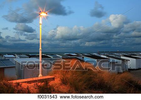 France, Pas-de-Calais, Opal Coast, beach cabins at Calais at nightfall View Large Photo Image Stock Image - France, Pas-de-Calais, Opal Coast, beach cabins at Calais at nightfall. Fotosearch