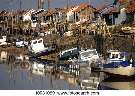 Stock Photo - France, Poitou Charentes, Marennes, oyster-farming canal. Fotosearch
